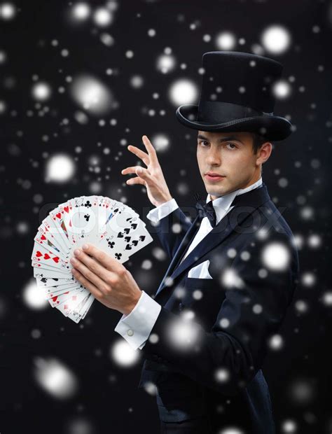 magician showing trick with playing cards | Stock image | Colourbox