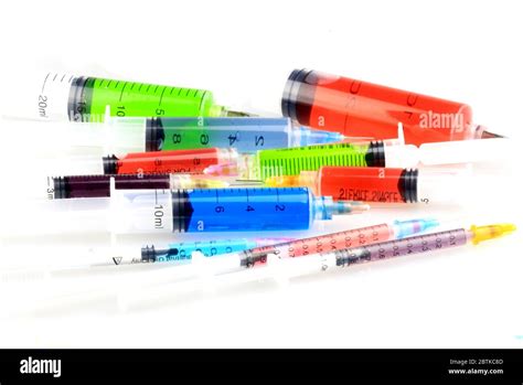 Disposable single use syringes on white background Stock Photo - Alamy