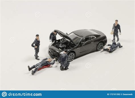 Mini Mechanics Repairing Toy Car Concept Of The Workshop Stock Photo