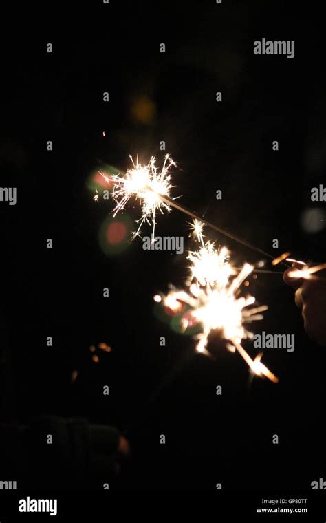 Sparklers on bonfire night Stock Photo - Alamy