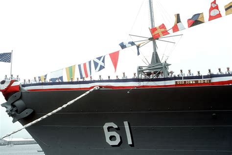 Crew Members Man The Rail On The Port Side Of The Uss Iowa Bb