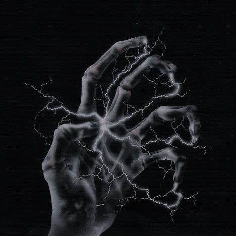 A Black And White Photo Of A Hand Holding Lightning