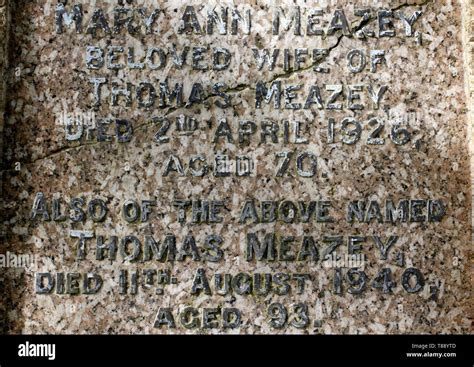 Headstone With Raised Letters Marking The Burial Place Of Mebers Of The