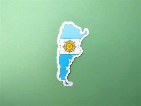 Premium Photo | Argentina flag stickers on a green background