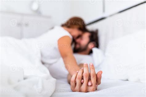 Romantic Couple In Bed Enjoying Sensual Foreplay Focus On Hands Man