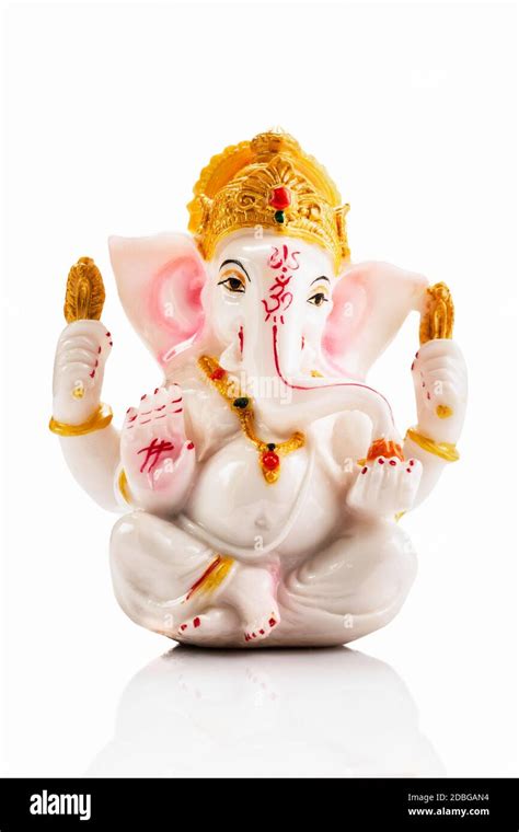 Ganesha statue isolated on white background with reflection Stock Photo ...