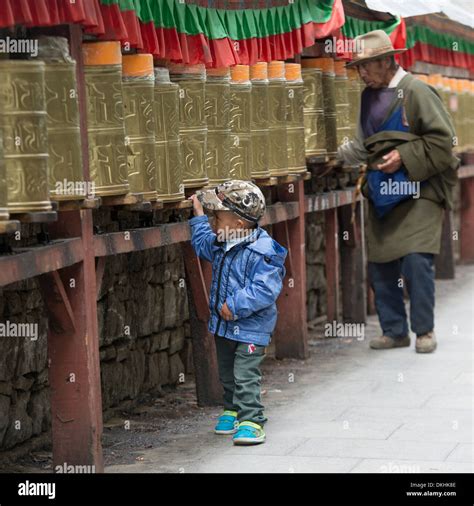 Pilgrims Spinning Prayer Wheels At Potala Palace Lhasa Tibet China