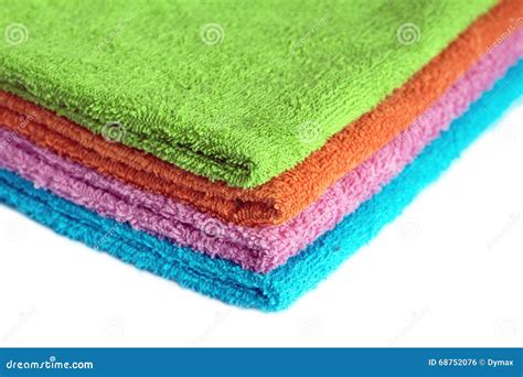 Four Bath Towels of Different Colors Stacked Isolated Stock Photo ...