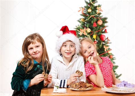 Kids eating cookies Stock Photo by ©anatols 8686534