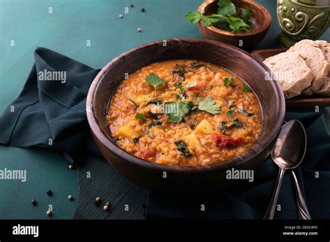 Vegan Red Lentil Stew With Potatoes And Spinach Stock Photo Alamy