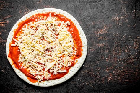 Preparation Pizza Rolled Out Round Dough With Tomato Paste And Cheese