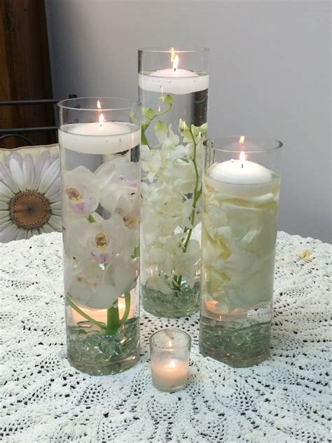 A Trio Of Cylinder Vases Using White Dendrobium Orchid S White