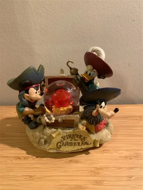 Boule Neige Disneyland Paris Pirates Des Cara Bes Mickey Donald Et