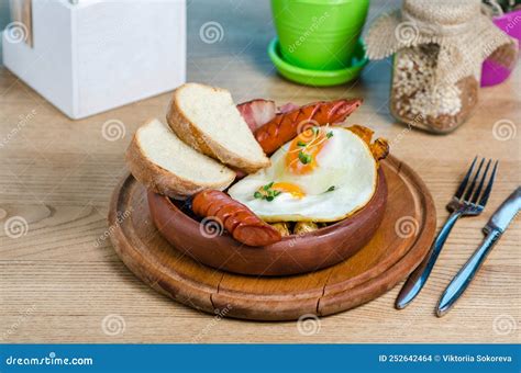 Full English Breakfast On A Plate With Fried Eggs Sausages Bacon