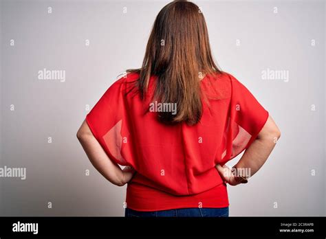 Beautiful Brunette Plus Size Woman Wearing Casual Red T Shirt Over Isolated White Background
