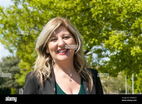 Happy Mature Blonde Woman Walking On The Park Stock Photo Alamy