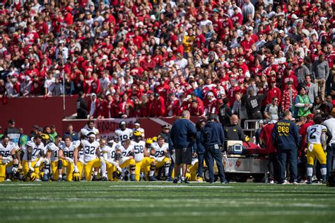 Michigan Football Coach Mike Hart Suffers Seizure Carted Off Field