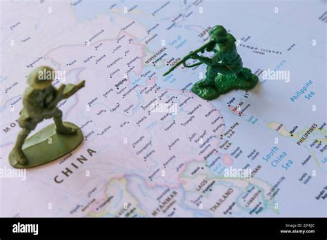 China and Taiwan conflict or war concept photo with figure soldiers on ...