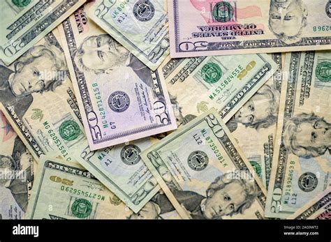 Overhead Shot Of Different Types Of Dollar Bills On Top Of Each Other