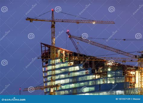 Crane on Top of Under Construction Building at Night. Stock Image ...