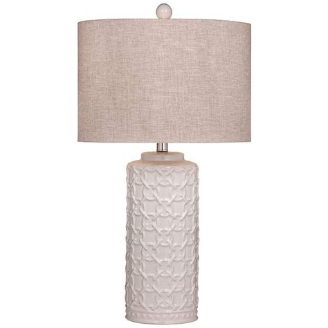 A White Table Lamp With A Beige Shade On The Base And A Light Grey Fabric Shade