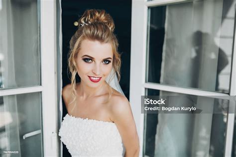 Stylish Happy Bride Posing And Smiling In Soft Light Near Window Balcony In Hotel Room Gorgeous