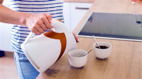 Woman Pouring Boiling Water Stock Photos Pictures And Royalty Free