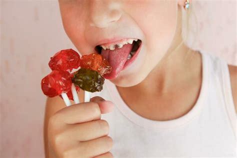 Child Eating Candy Stock Photos, Images and Backgrounds for Free Download