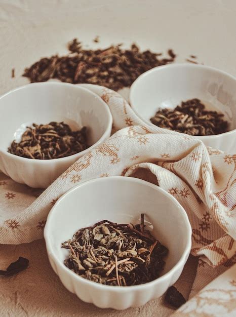 Premium Photo Small Bowls With Dried Healing Green Tea And Herbs