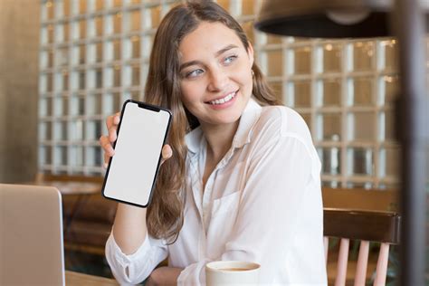 Young Woman Holding Iphone Mockup Generator Mockup World