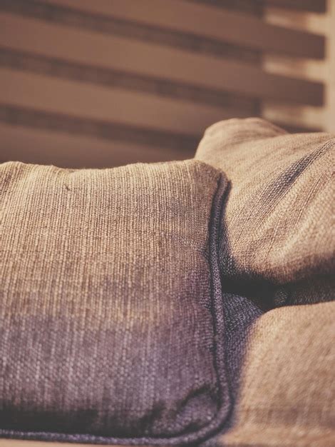 Premium Photo Close Up Of Cushions On Sofa