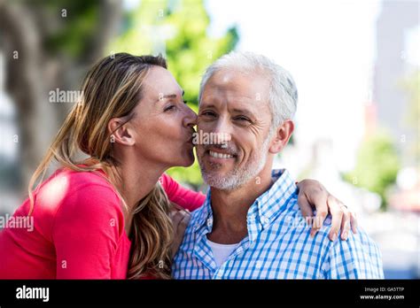 Romantic Mature Woman Kissing Man Stock Photo Alamy