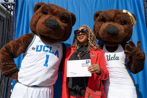 Photo | Fan holding envelope with Wooden stamp, flanked by Joe and ...