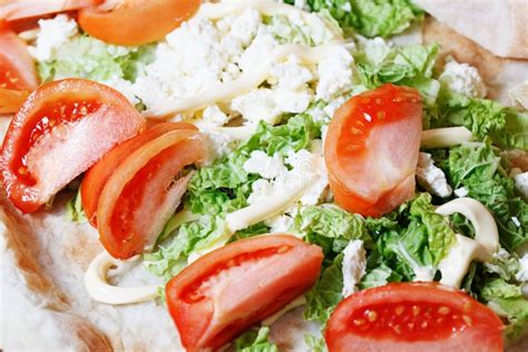 Pita Bread Wrapped With Cottage Cheese And Vegetables Stock Photo