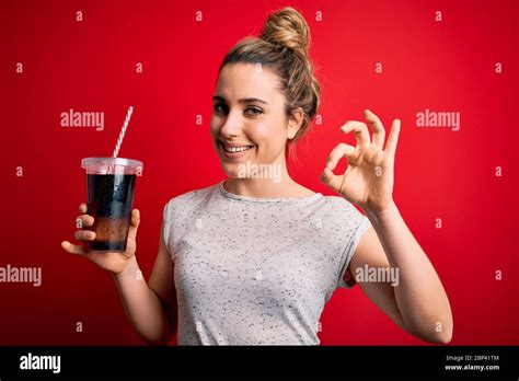 Beautiful Blonde Woman Drinking Cola Fizzy Beverage To Refreshment Over