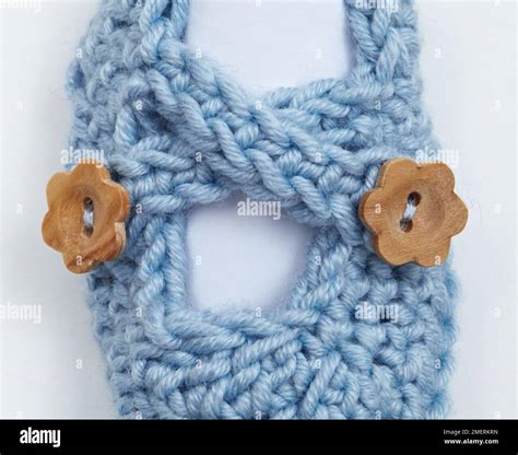 Crocheted Babys Booties With Wood Buttons Stock Photo Alamy