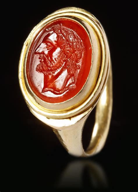 A ROMAN CARNELIAN INTAGLIO WITH GOLD RING CIRCA 2ND 3RD CENTURY A D