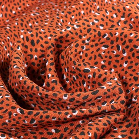 Tissu Viscose Twill Rosella Sur Fond Rouille Par 10 Cm