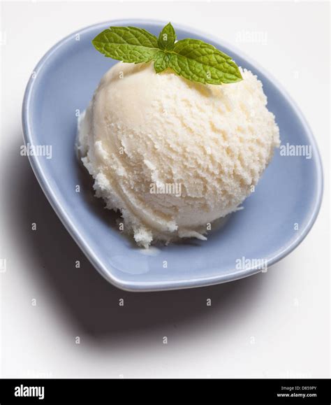 Scoop Of Lemon Ice Cream With Peppermint Decoration Stock Photo Alamy