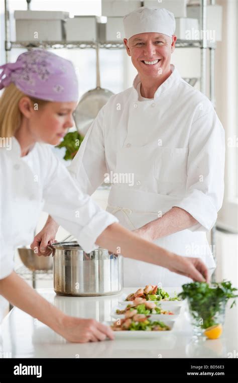 Chefs Making Salad In A Kitchen Stock Photo Alamy