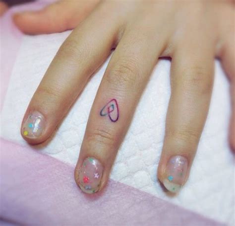 Attractive Heart Tattoos On Fingers