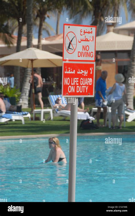 Arabic Warning Signs In Pool In Salalah Southern Oman Stock Photo Alamy