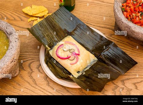 Mexican Tamale With Recipe For Cochinita Pibil On Folded Banana Leaf