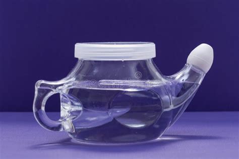 Neti Pot With Soft Comfort Tip Isolated On Purple Sinus Wash Nasal