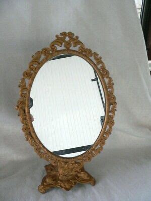 ANCIEN MIROIR OVAL à posé en métal dorée à décor de fleure EUR 38 00