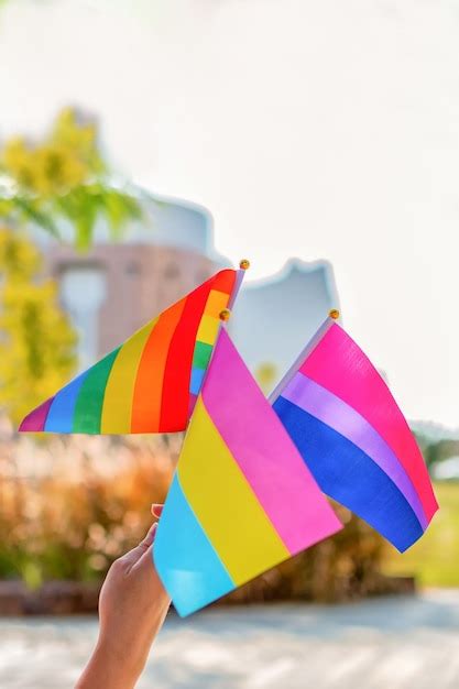 Premium Photo Gender Queer People Wave LGBTQ Gay Pride Rainbow Flags