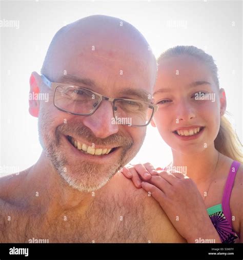 Father And Daughter Selfie Smiling And Happy In The Sunshine On A Beach