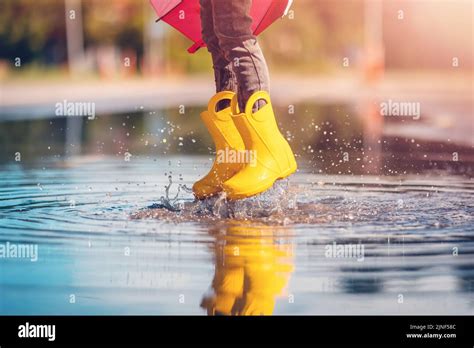 Kid Child Jumping Puddle Water Splash Hi Res Stock Photography And