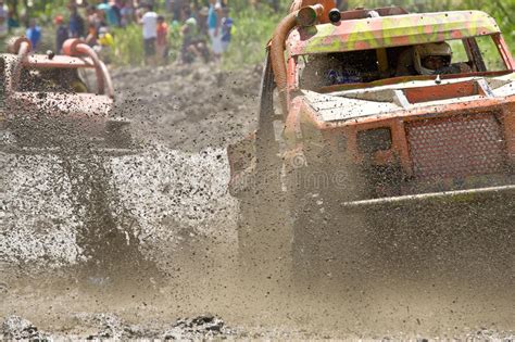 Tough Mudder Racers Climbing Over An Obstacle Editorial Image Image