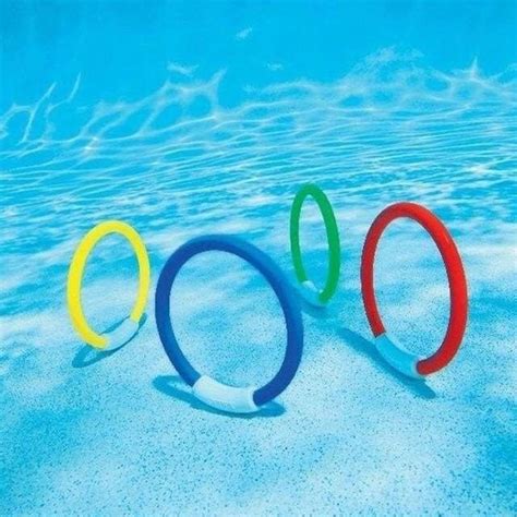 The Olympic Rings Are Floating In The Blue Water At The Bottom Of The Swimming Pool